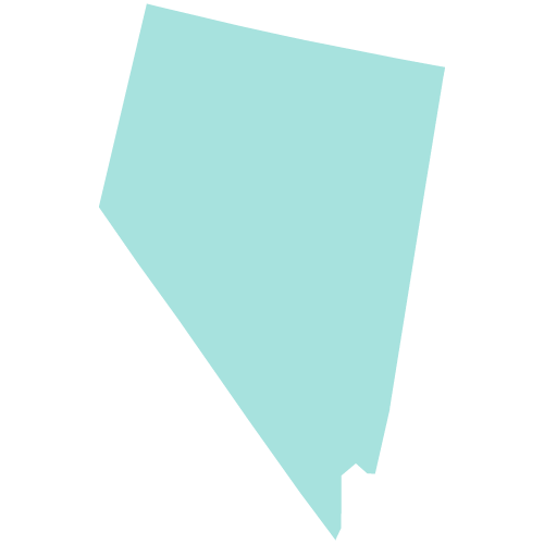 A group of people stand and sit closely together, smiling at the camera.